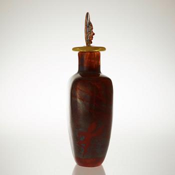 A Kjell Engman cast glass bottle with stopper, Kosta Boda 1991.