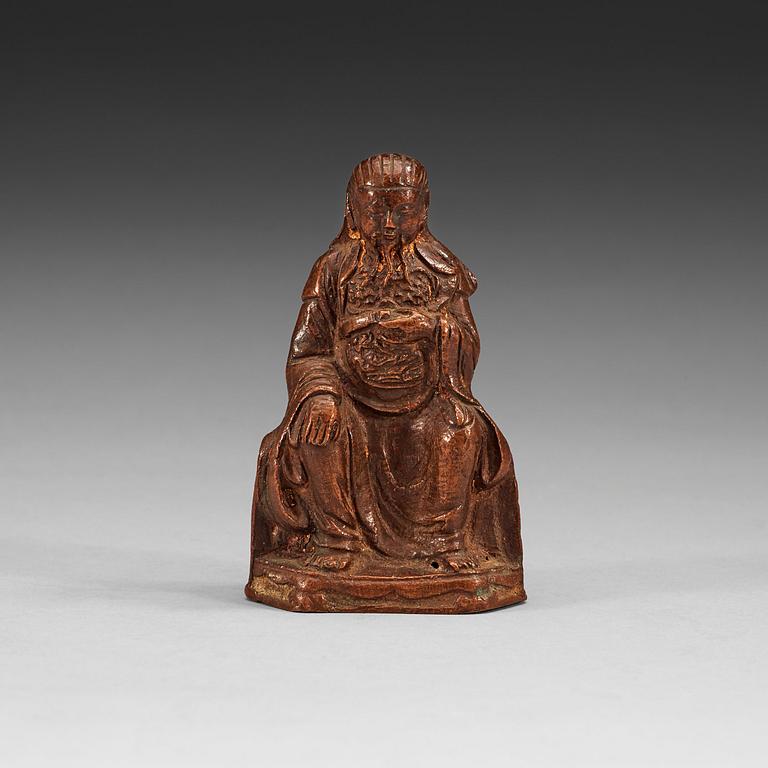 A seated copper-alloy figure of a the God of War, Guan Di, Ming dynasty (1368-1644).