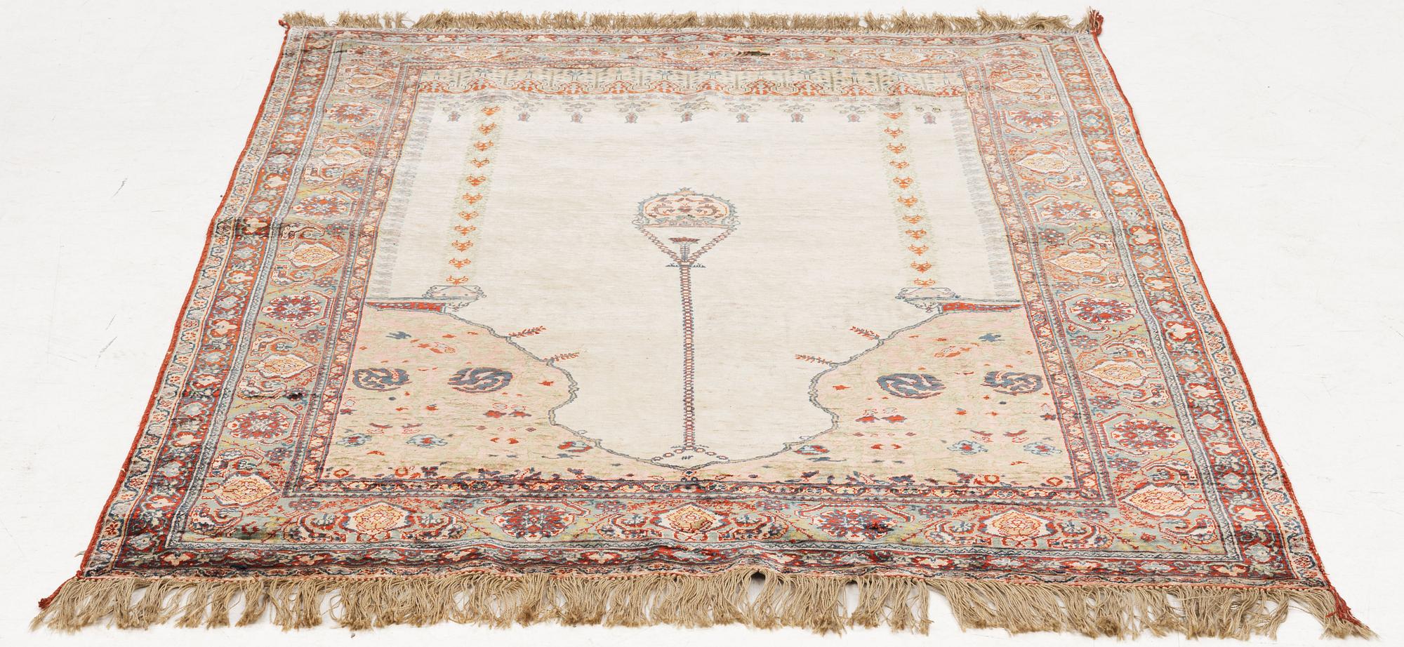 A semi-antique silk rug, probably Tabriz, c 164 x 110 cm,.