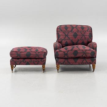 A Howard style easy chair with av footstool, 21st Century.