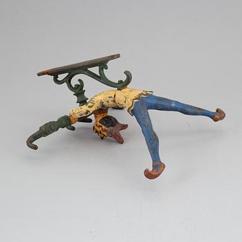 A cast iron clothes-hanger from the 20th century.