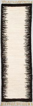 A sheepskin carper for Furcarpet. Circa 300x95 cm.