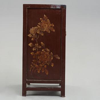 A carved and gilt wooden cabinet, Qing dynasty (1664-1912).