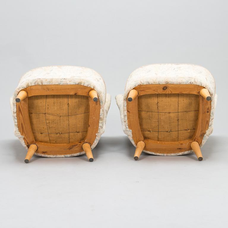 A pair of mid 20th century armchairs.