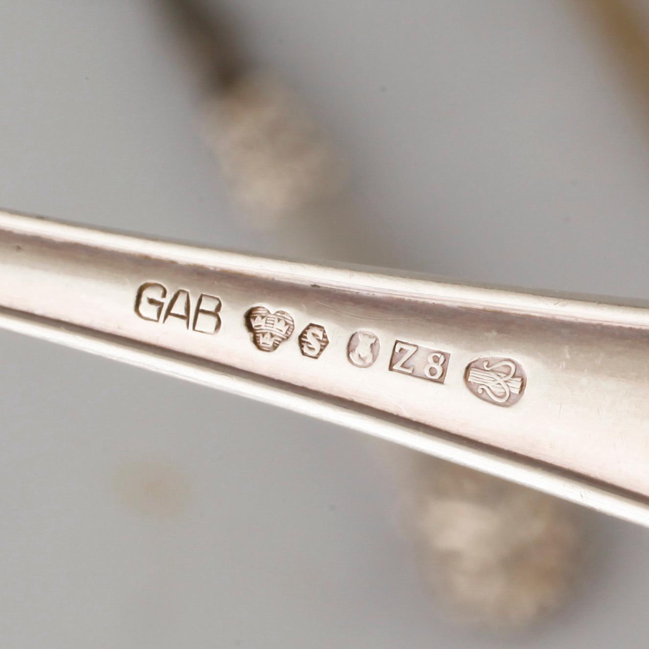 A collection of silver of 57 pcs, i.a souvenir spoons, 20th century. Total weight 1073 g.