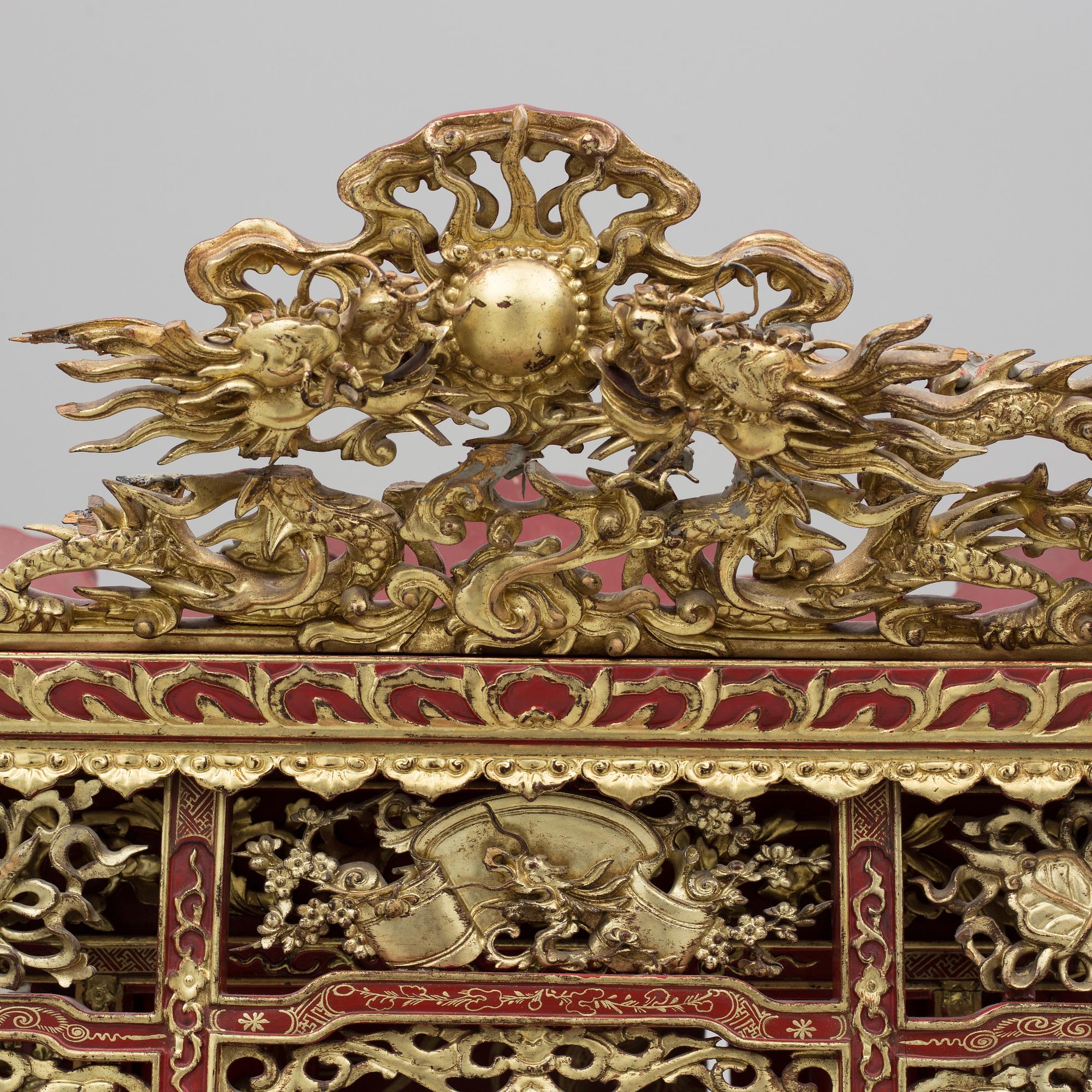 A Chinese red lacqured altar cabinet, late Qing dynasty/early 20th century.