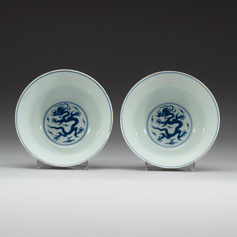A pair of blue and white five clawed dragon bowls, Qing dynasty with Qianlong's sealmark and period (1736-95).