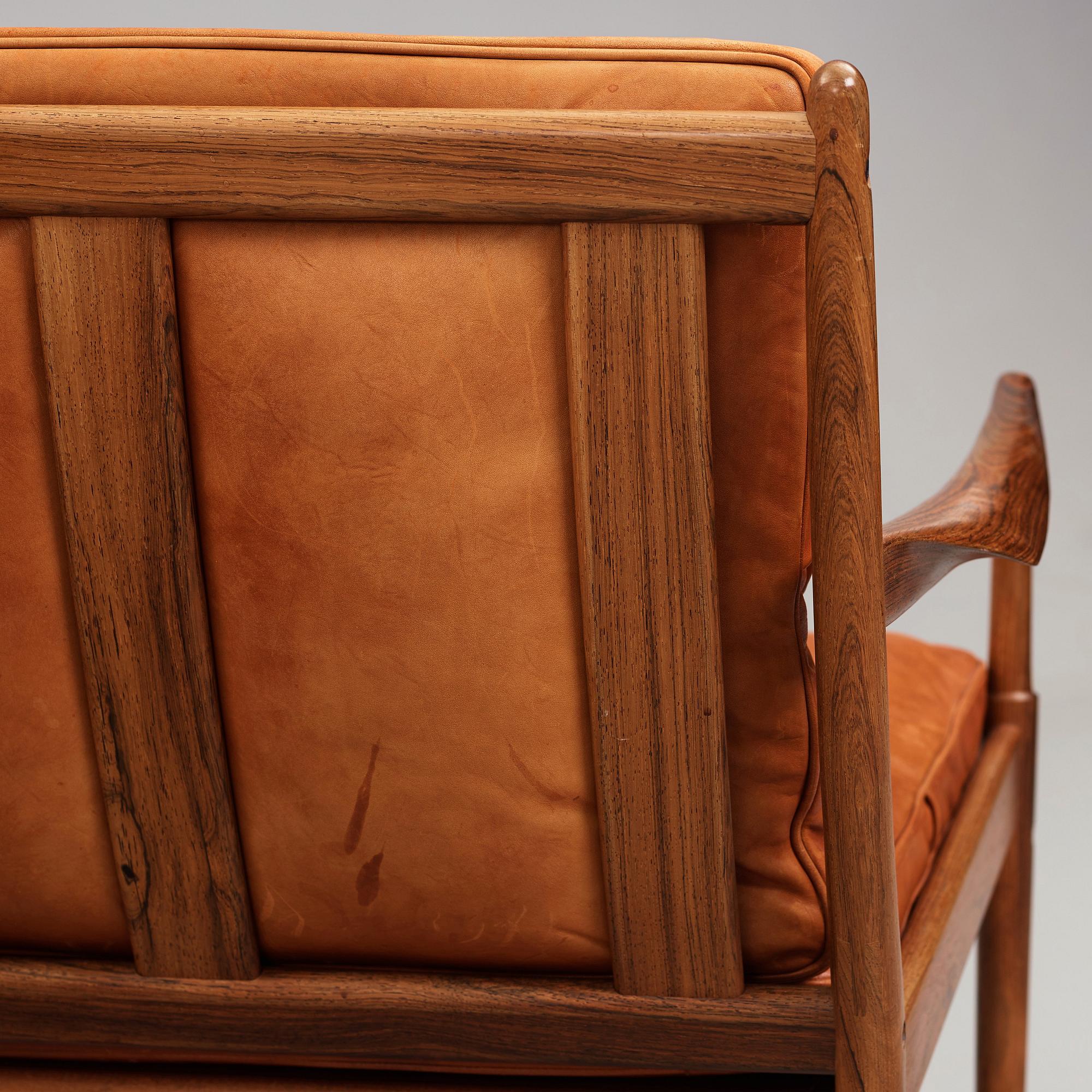 Ib Kofod-Larsen, a pair of "Samsö" palisander and brown leather easy chairs, Olof Persons Fåtöljindustri (OPE) Sweden 1960's.