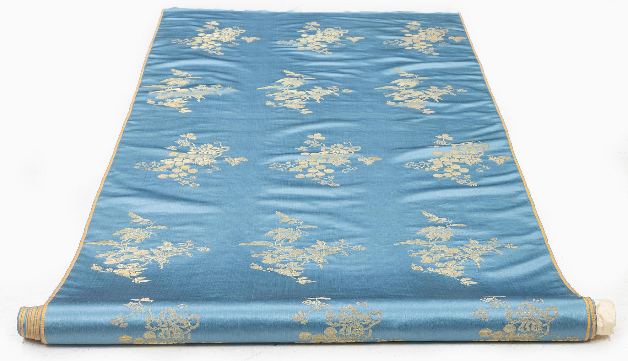 A bolt of Chinese pale blue and gold silk fabric, early 20th century.