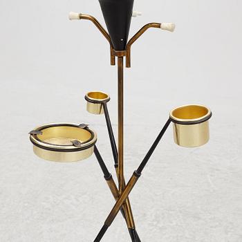 A 1950's floor lamp with ashtray and cigarette holder, Stilnovo.