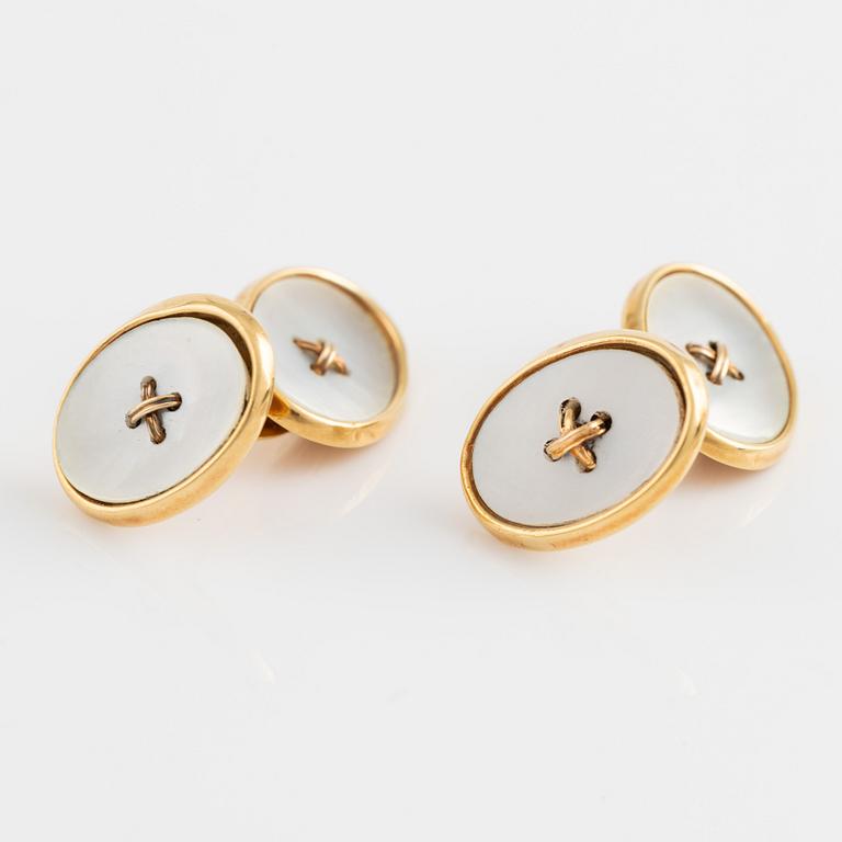 18K gold and mother of pearl cufflinks.