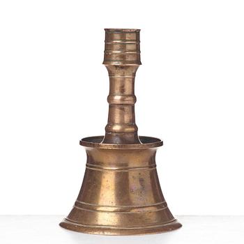 A CANDLESTICK, bronze/copper alloy, Ottoman, Turkey 16th-17th century, height 24 cm, the foot diameter 15,5 cm.