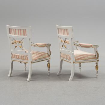 A set of two armchairs, a sofa, a stool and a chair. Early 20th century.