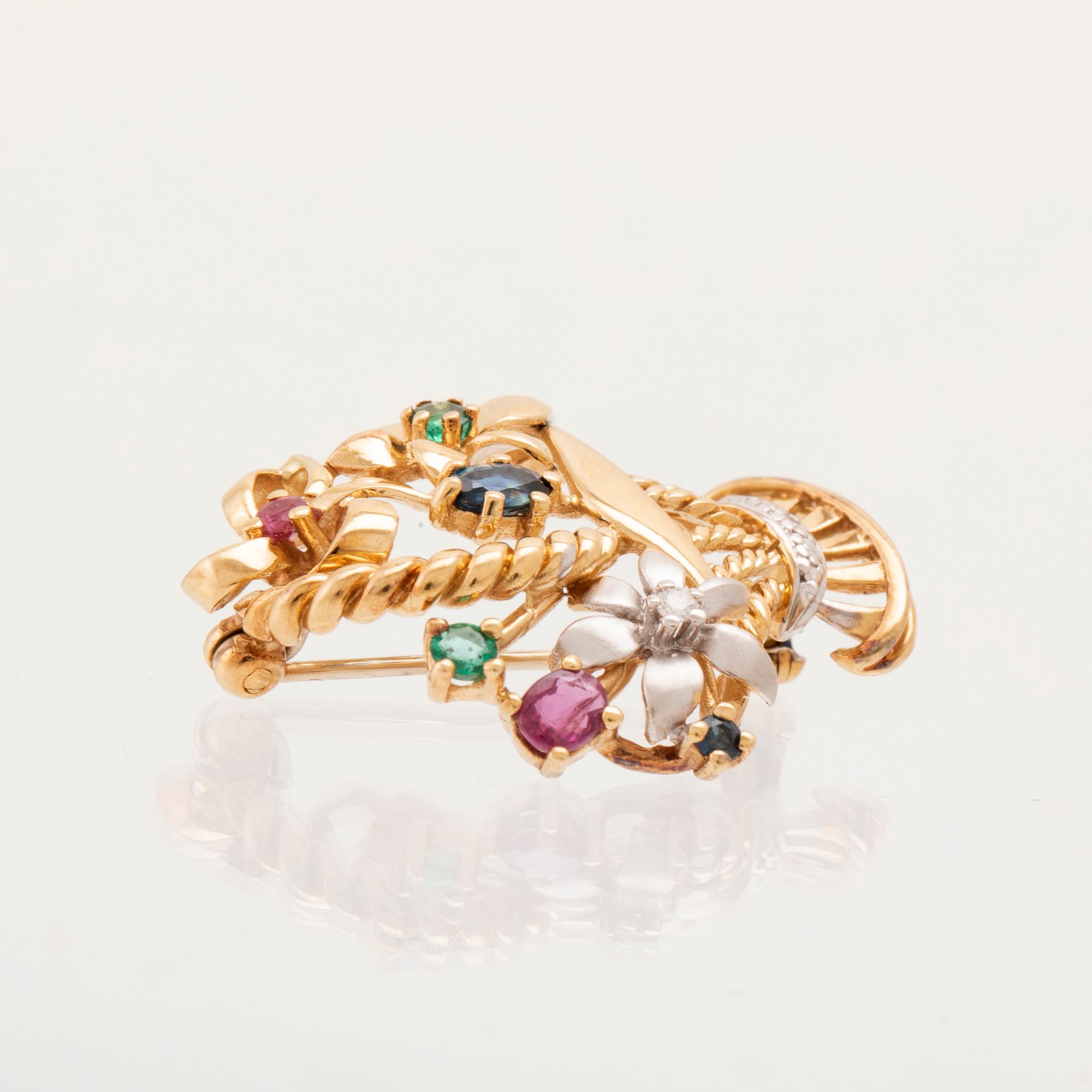 Brooch 18K white and red gold with round brilliant-cut diamonds and faceted rubies, emeralds, and sapphires.