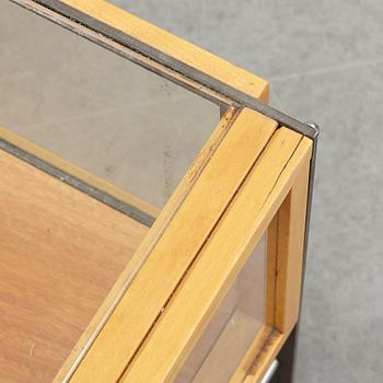 A glass top coffee table, late 20th Century.