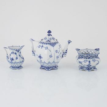 A 'Musselmalet' porcelain teapot, a creamer and a sugarbowl, Royal Copenhagen, Denmark.