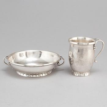 GEORG JENSEN,  a 830/1000 silver mug and  a bowl (a christening set), Copenhagen ca 1918-1927, design nr 127, 158.