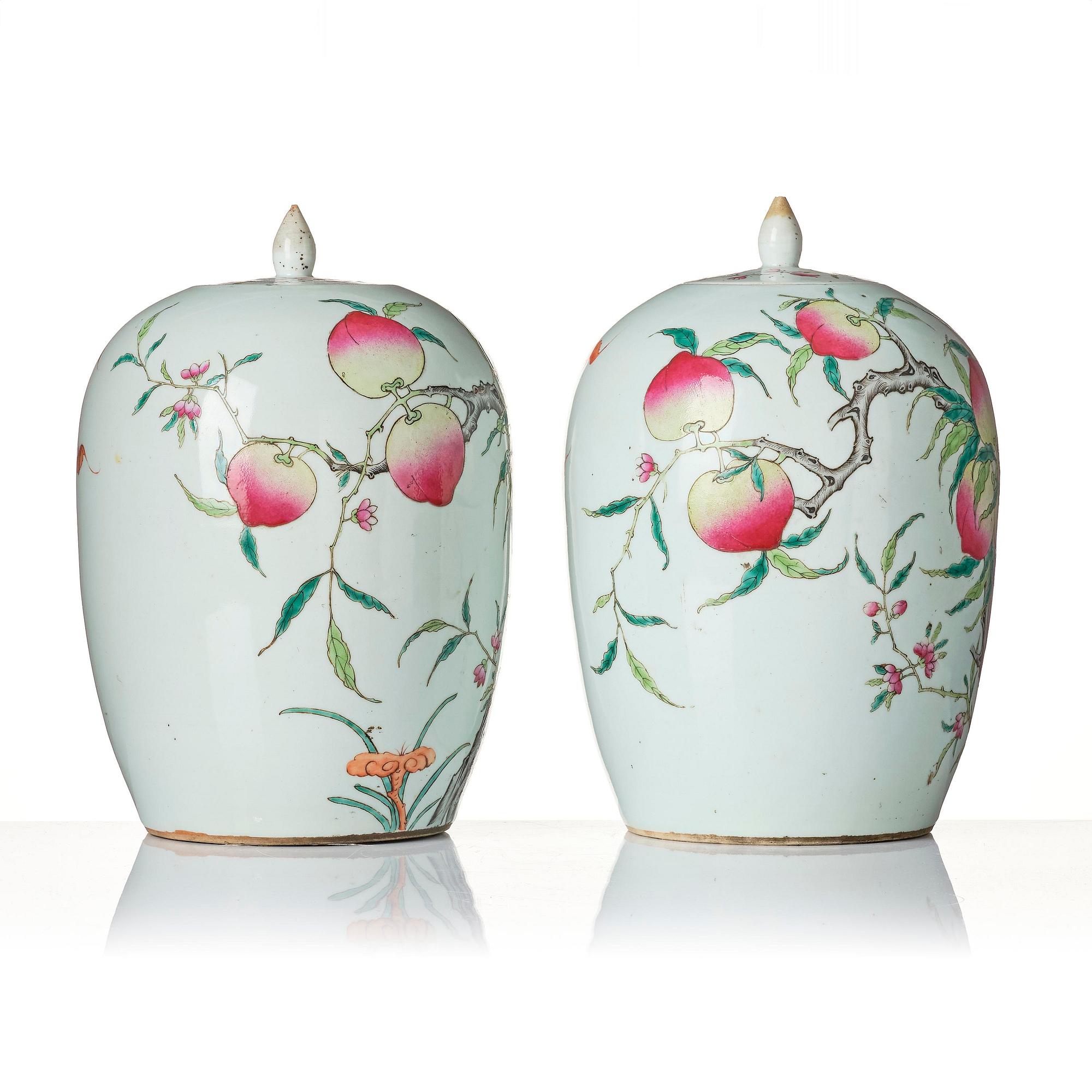 A pair of famille rose 'peaches' jars with cover, Qing dynasty, circa 1900.