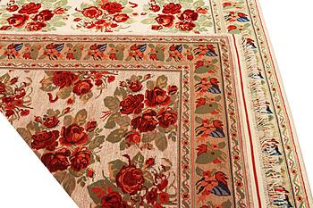 A carpet with a rose pattern, c. 310 x 196 cm.