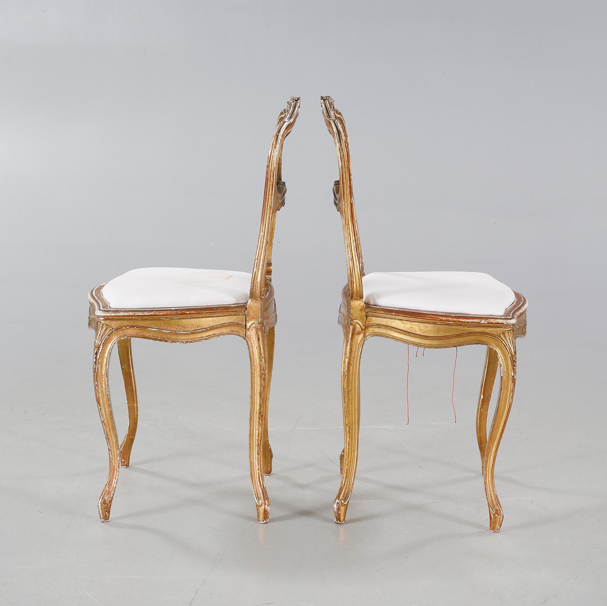 A pair of chairs from the first half of the 20th century.