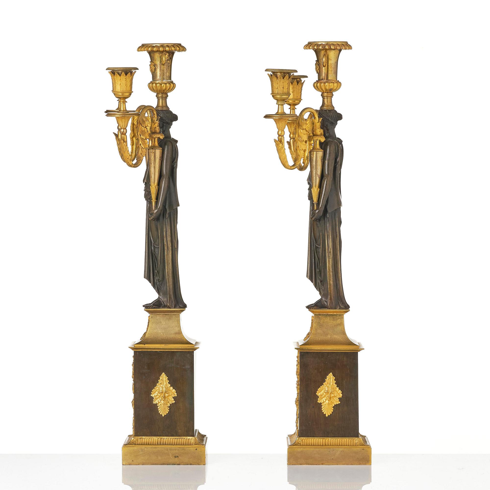 A pair of French Empire ormolu three-branch candelabra, Paris, early 19th century.
