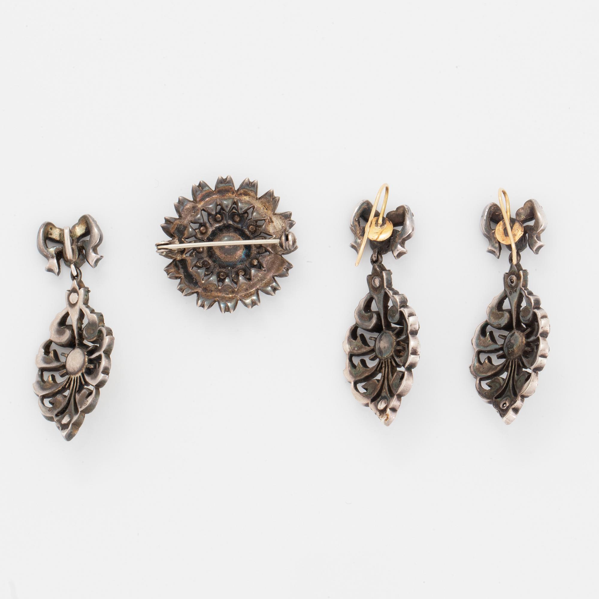 Earrings, brooch, and pendant silver with paste.