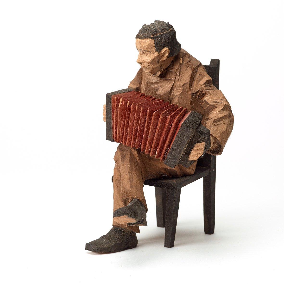 Axel Petersson Döderhultarn, Seated accordionist.