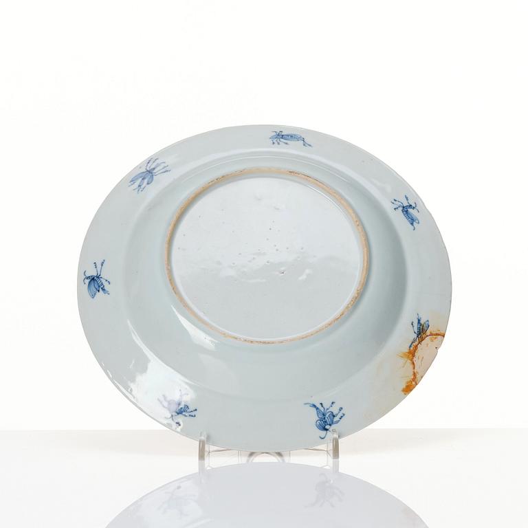 Chinese Imari ’Dame au Parasol’ plate decorated in underglaze blue, iron-red and gilt, Qing dynasty, Qianlong 1730-40.