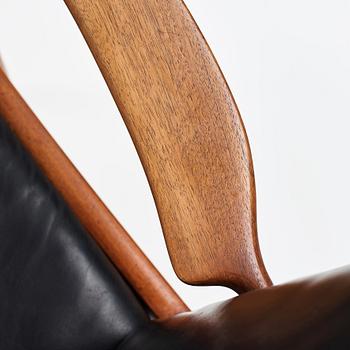 Hans J. Wegner, a pair of "AP16" teak and black leather armchairs, AP-stolen, Denmark 1950-60´s.