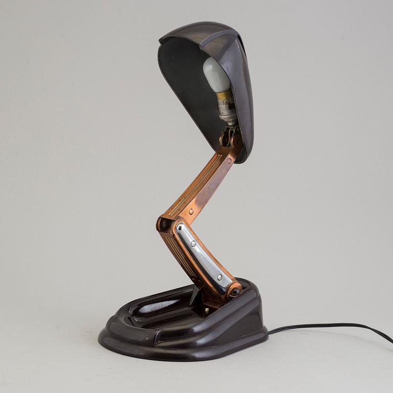 a bakelite and metal table 'Bolide' table lamp, by JUMO, 1940's.