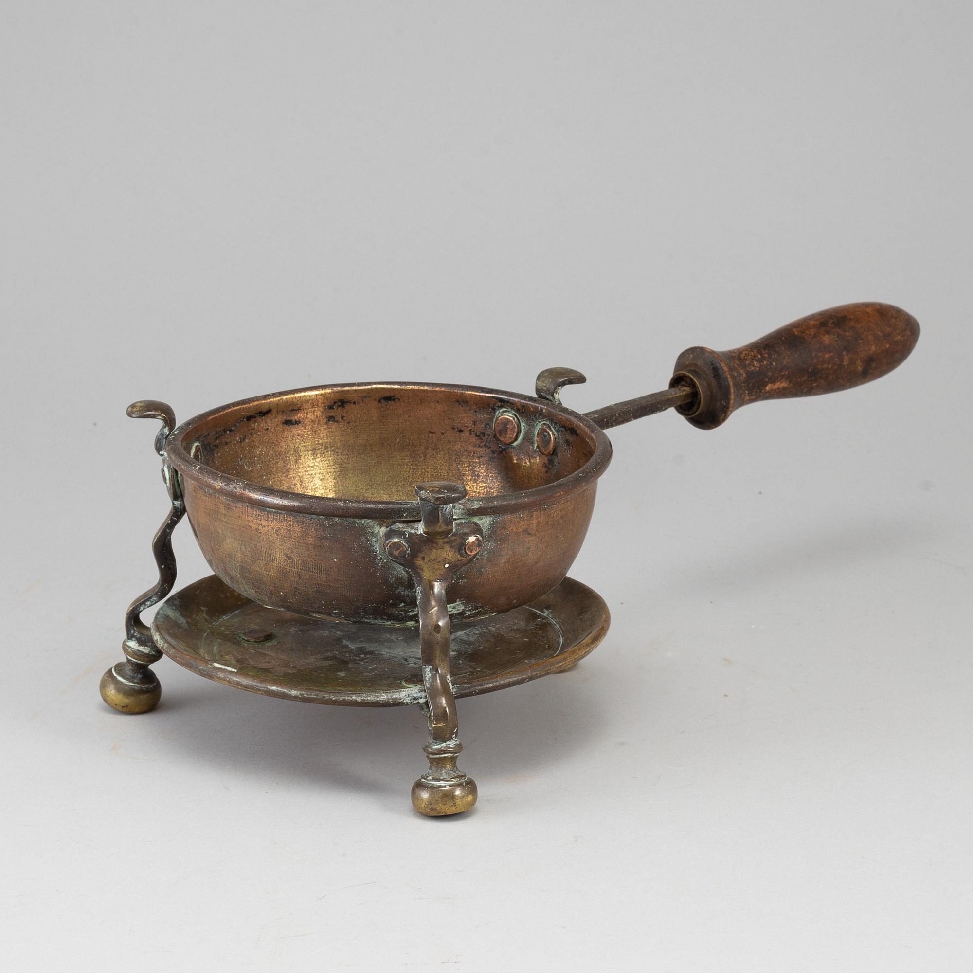 An 18th century brass brazier.
