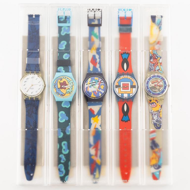 Parti med 21 Swatch-klockor, gummiband och klocklitteratur, "No Reserve".