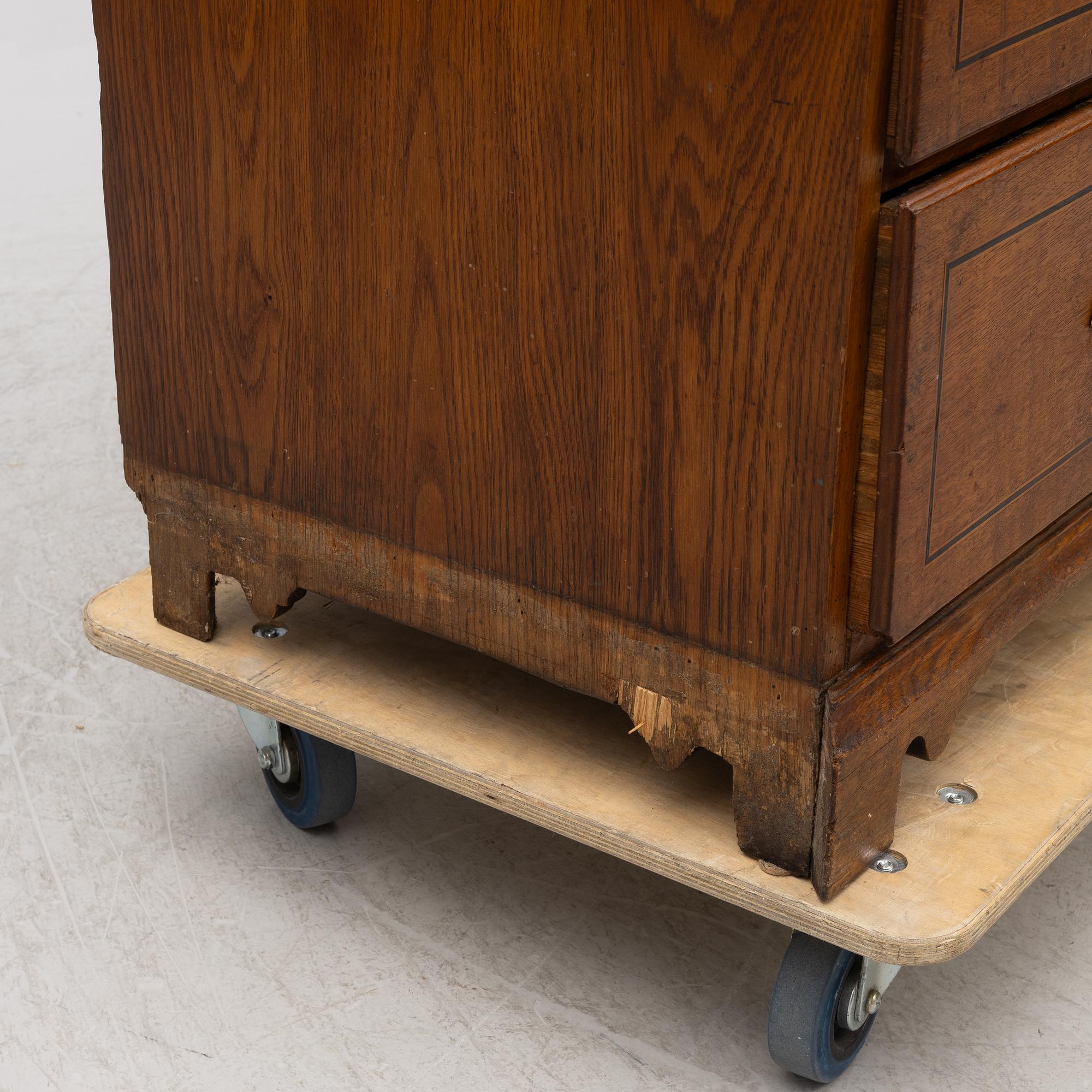 An oak secretaire, first half of the 19th century.
