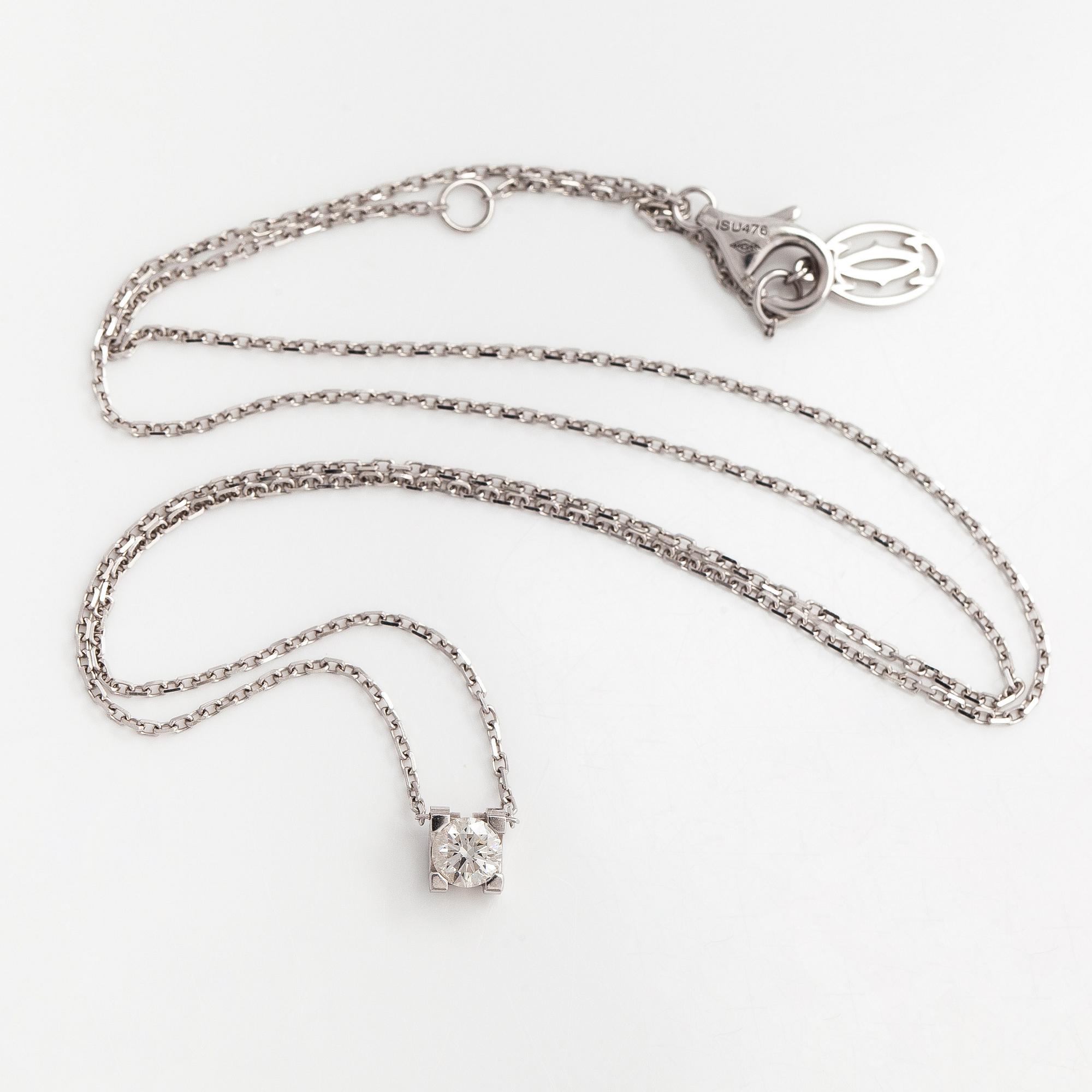 Cartier, an 18K white gold 'C de Cartier' necklace with a brilliant-cut diamond.