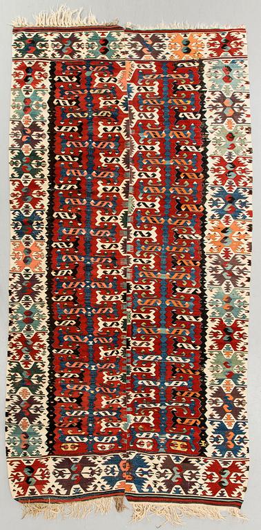 A semiantique Kilim ca 330 x 161 cm.