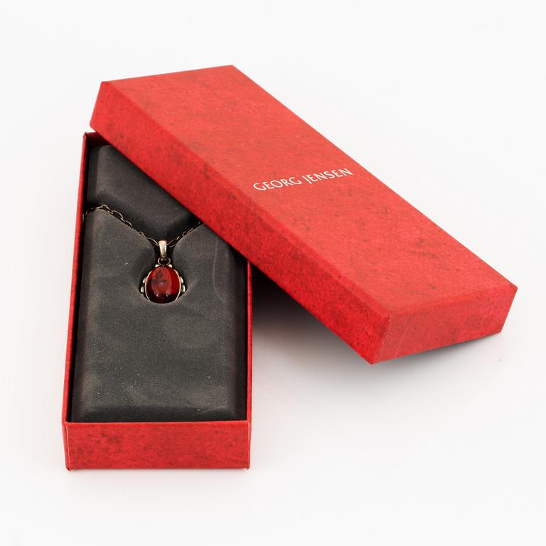 A Georg Jensen silver and cabochon-cut amber necklace.