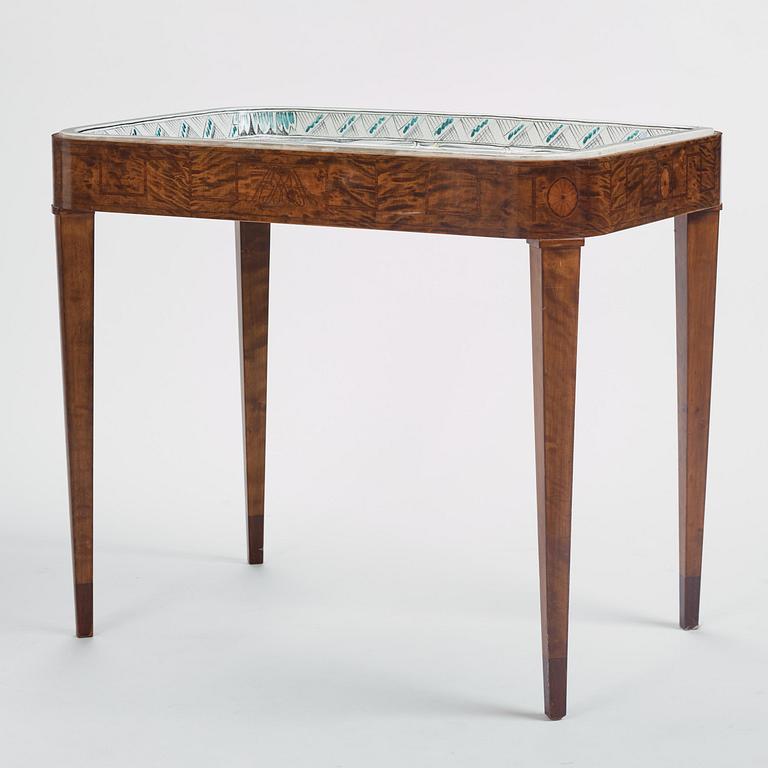 Tyra Lundgren, a faience table top, Arabia, Finland, 1927, on birch base by David Blomberg, Stockholm.