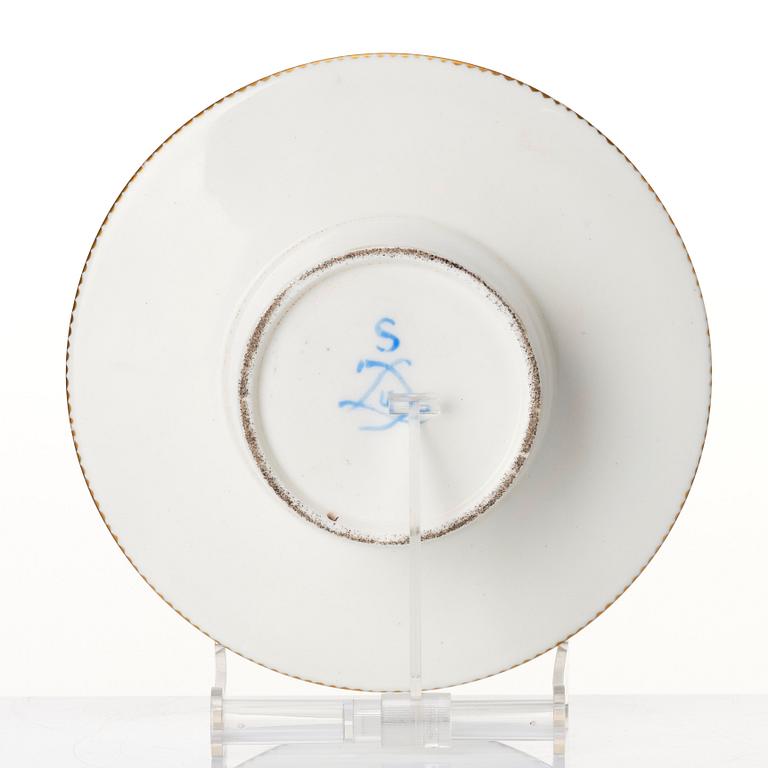 A French 'Sèvres' cup and tremleuse saucer, 19th Century.