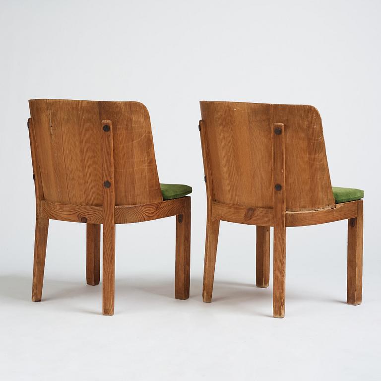 Axel Einar Hjorth, a pair of stained pine 'Lovö' chairs, Nordiska Kompaniet Sweden 1930s.