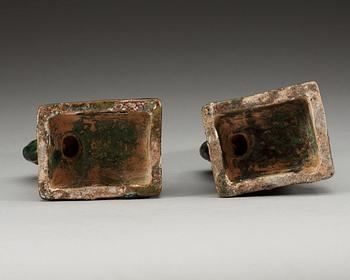 A pair of green glazed figures of 'Buddhist Lions', Ming dynasty.