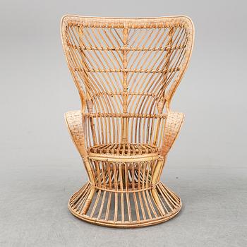 GIO PONTI & LIO CARMINATI, A 'Conte Biancamano' rattan Wingback Armchair for Bonacina, Italy.