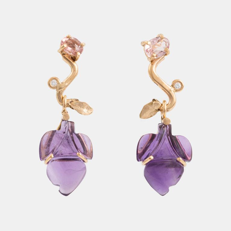 Earrings with cut amethysts, tourmaline, and small diamonds.