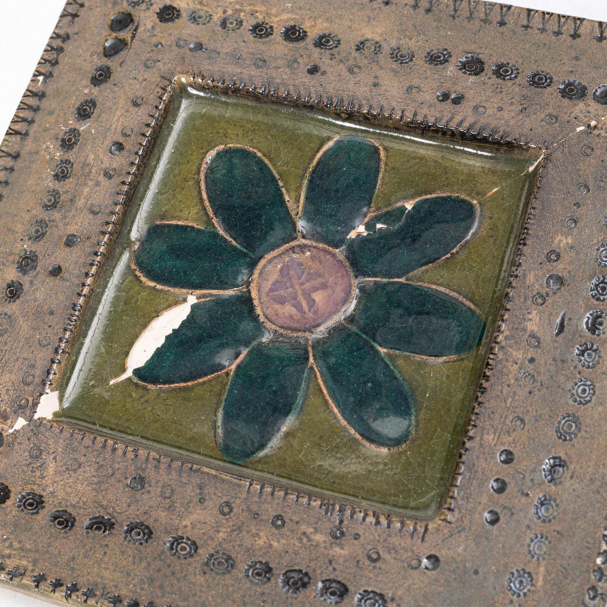 Rut Bryk, plates, as well as plate/wall relief, stoneware.