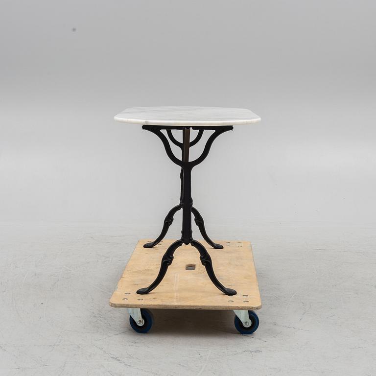 A marble and wrought iron table, Kare Design, 21st century.