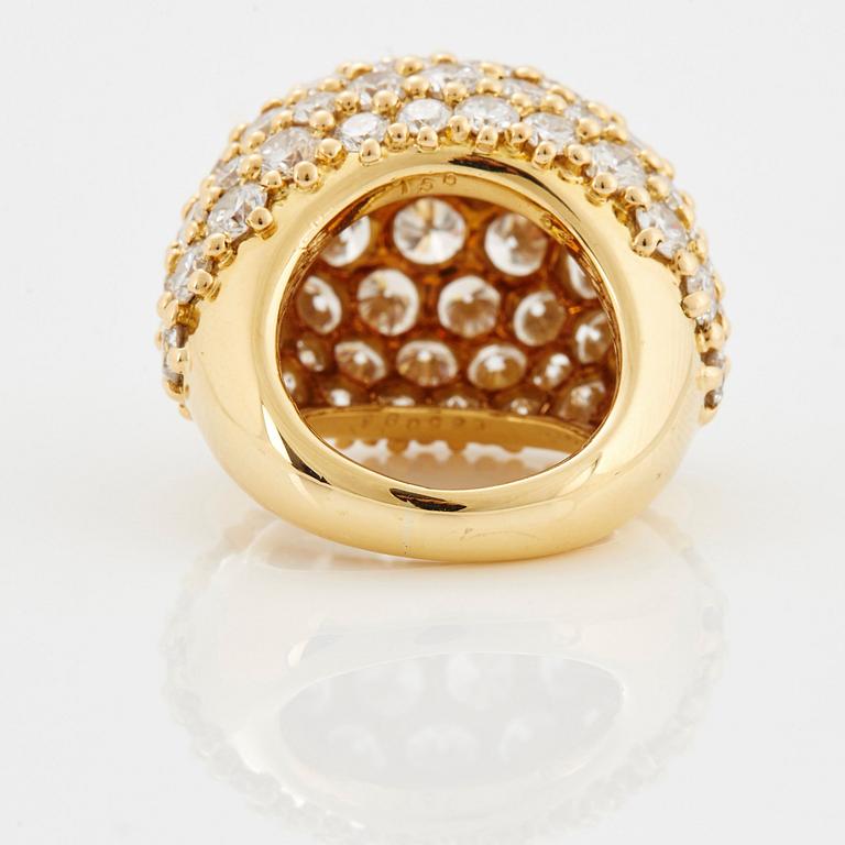 Cartier "Marrakech" an 18K gold bombé ring set with round brilliant-cut diamonds.