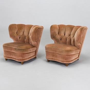 A pair of mid 20th century armchairs.