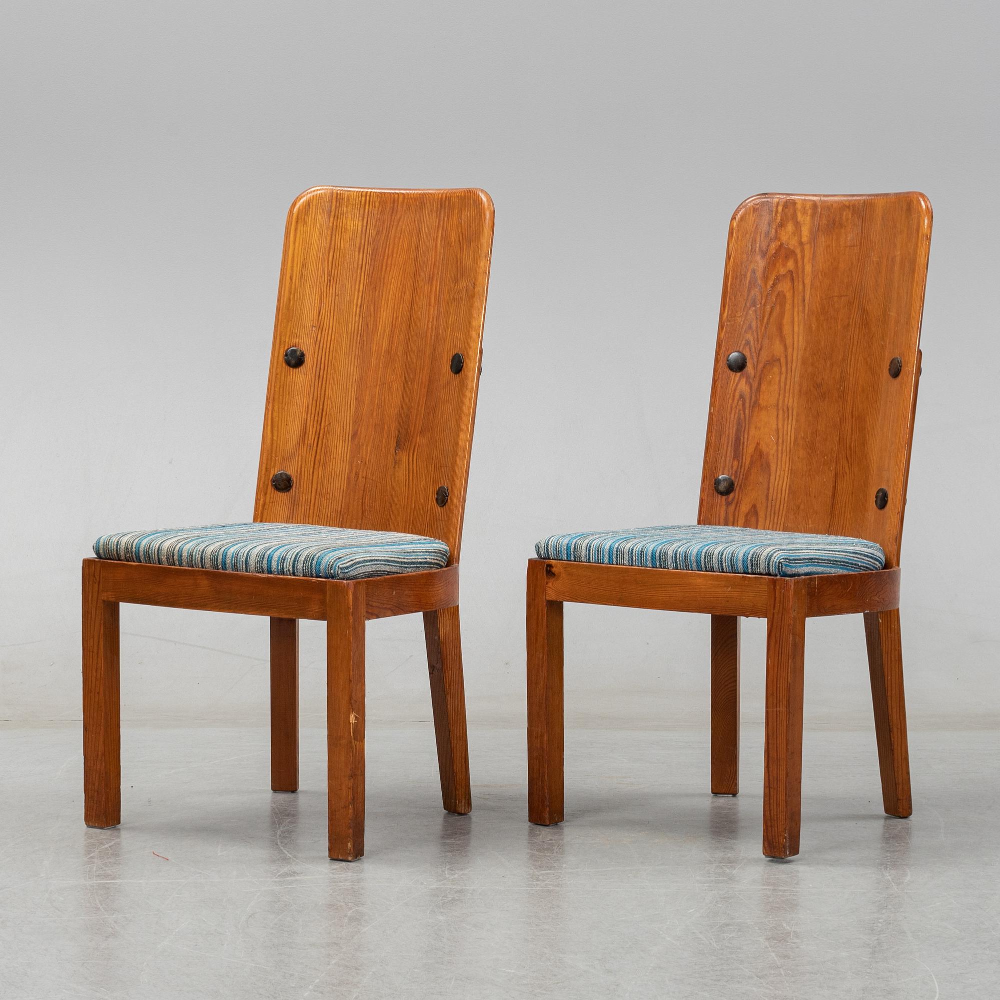 Axel Einar Hjorth, a pair of stained pine "Lovö" chairs, Nordiska Kompaniet, Sweden 1930's.