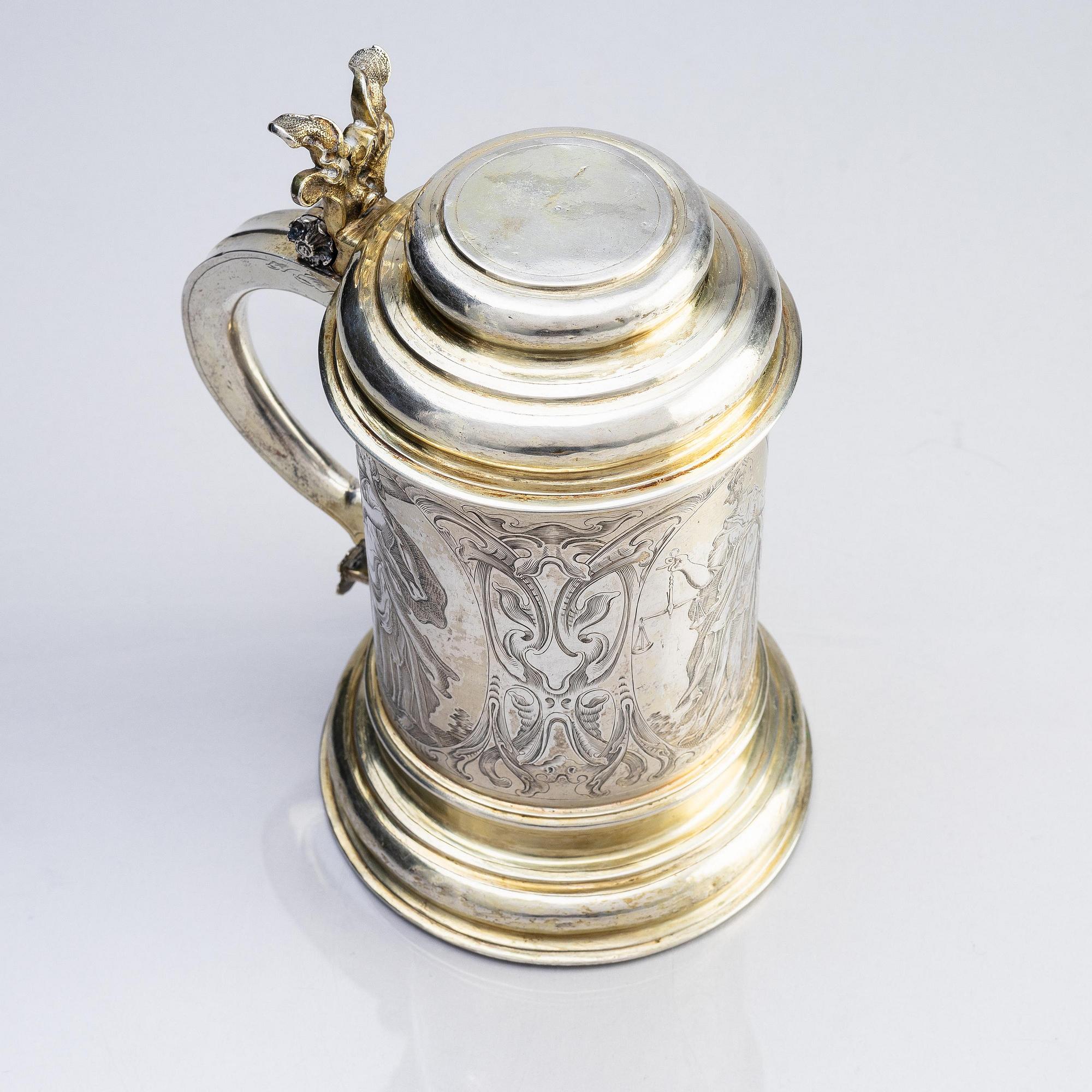 A German parcel-gilt silver tankard, mark of Walter Kopman, Hamburg (1649-1688).