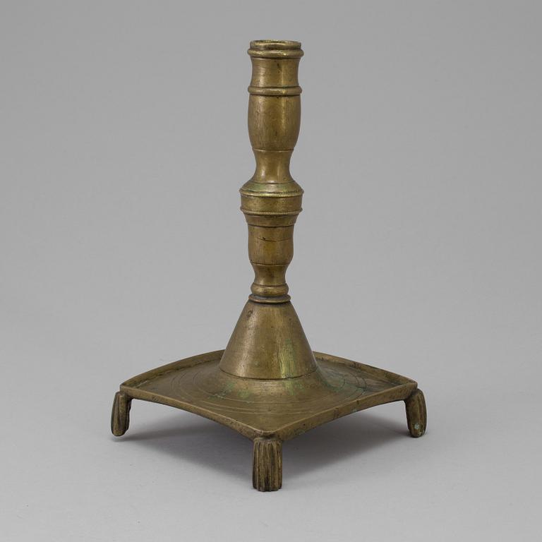 A 17th century bronze candlestick.