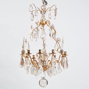 A Louis XV-style rock crystal eight-light chandelier, 20th century.